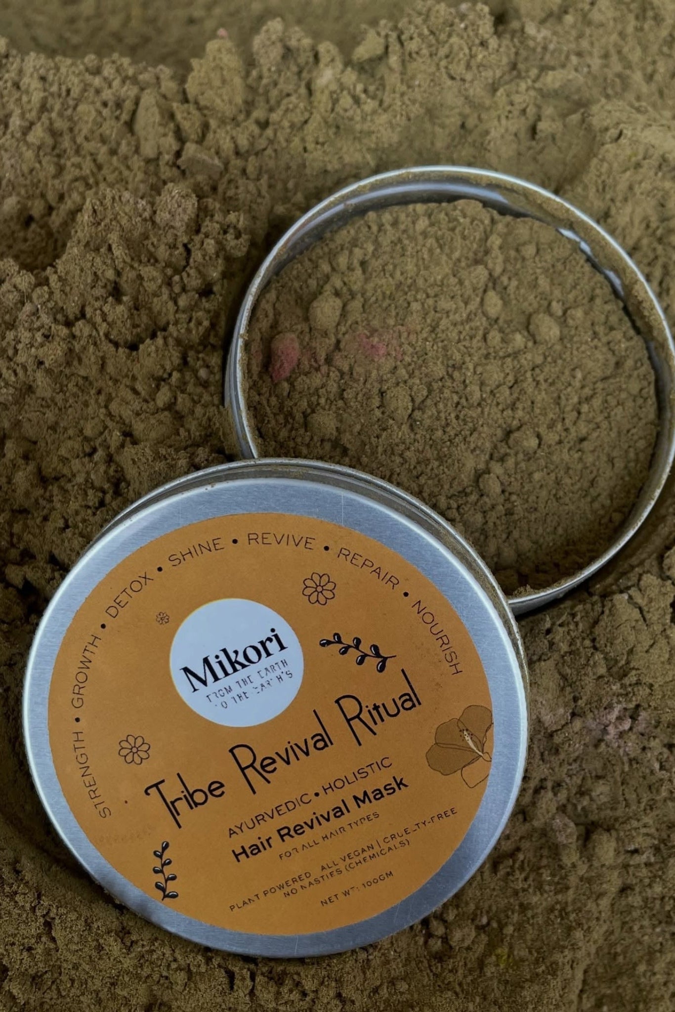 Mikori Tribe Revival Ritual hair mask container on a sandy background